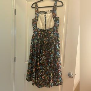 Unique Vintage Black Floral Dress with Front Ruffle Lace Overlay Design.
